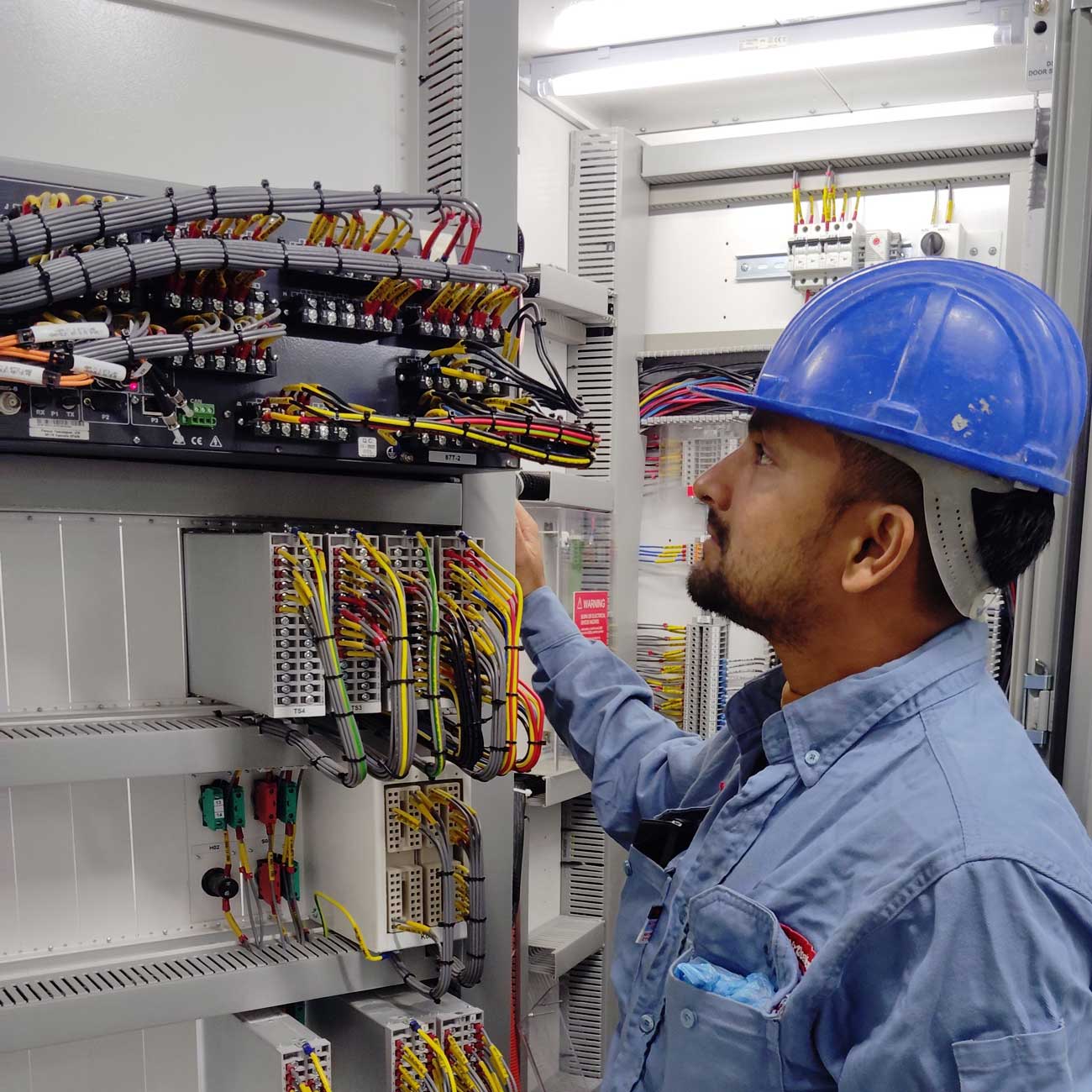 man working in an electrical room